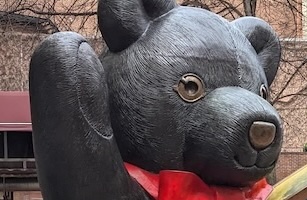 A bronze teddy bear head