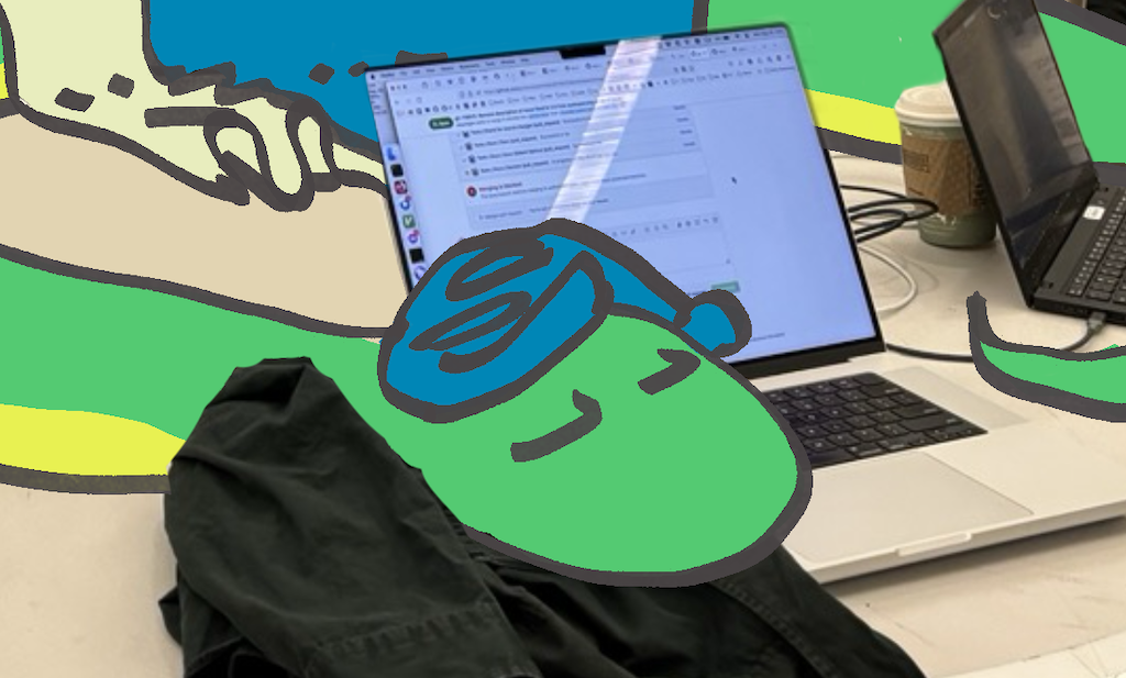 Sleepy Snake snoozing near a laptop